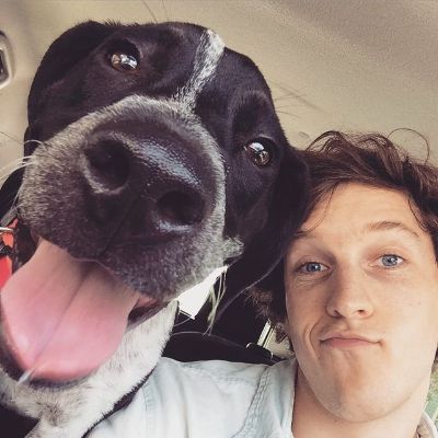 The dog face is right at the camera in this selfie.